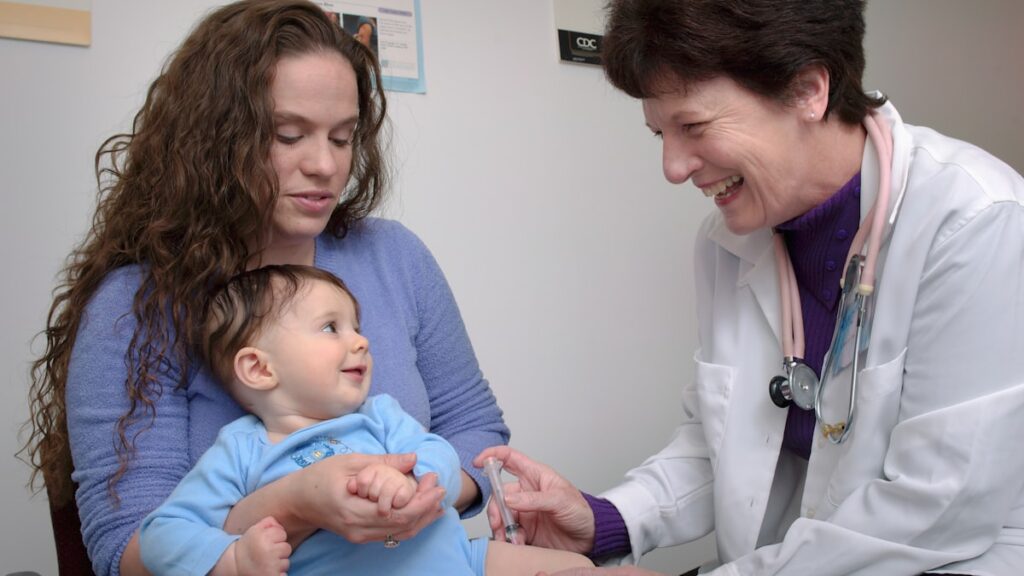 Doctor examining a child during a sports physical