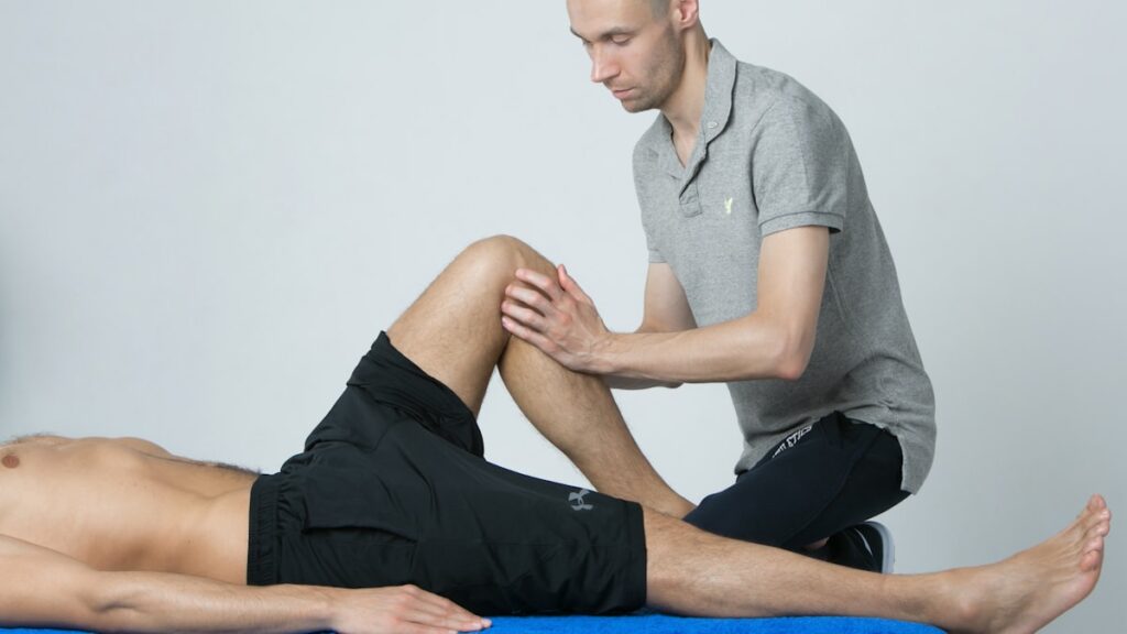 Doctor examining a patient knee