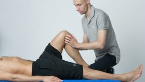 Doctor examining a patient knee
