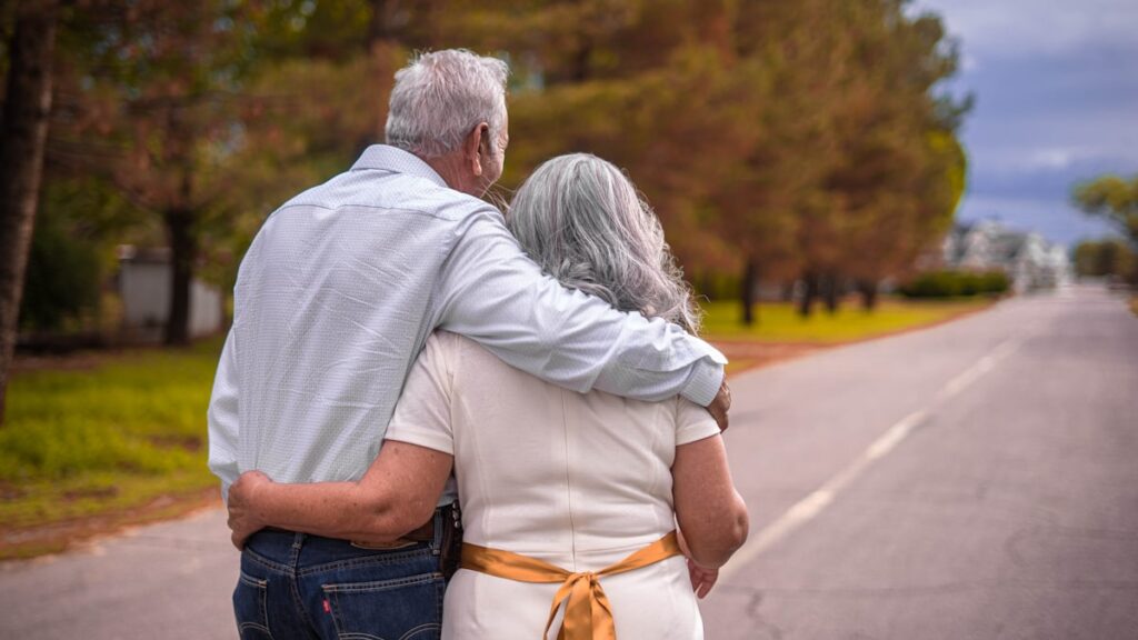 Older couple walking together for heart and joint health
