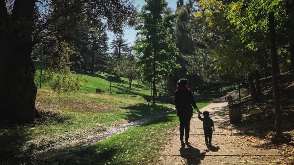 Parent spending active time outdoors with a child