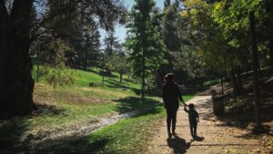 Parent spending active time outdoors with a child